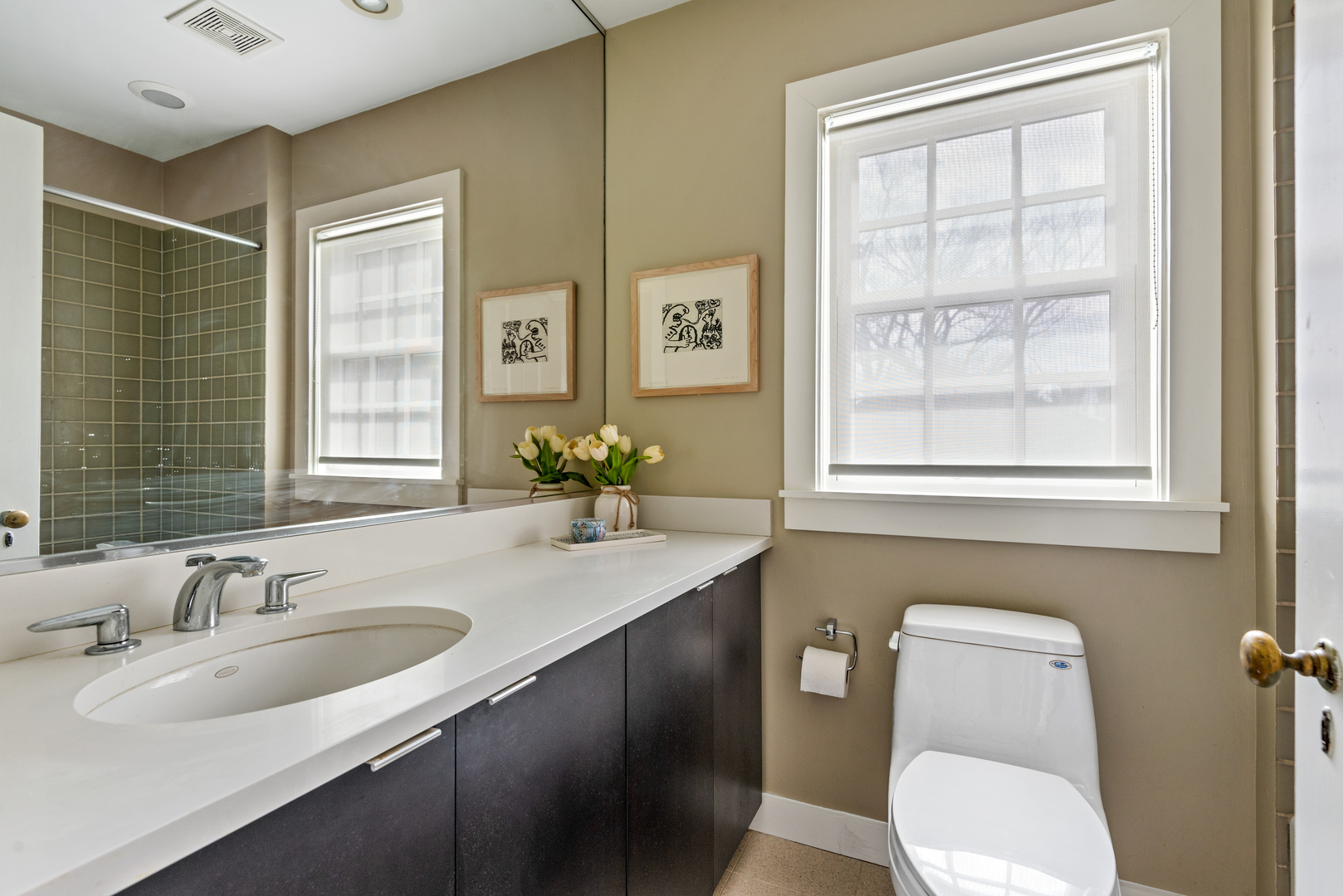 700 Park Drive Kenilworth, IL 60043 - Photo 25 of 34 a bathroom with a granite countertop toilet a sink and mirror