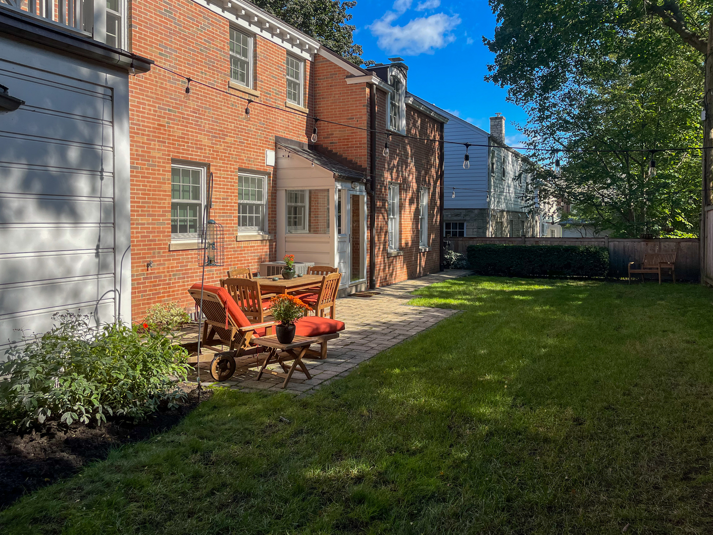 700 Park Drive Kenilworth, IL 60043 - Photo 30 of 34 a view of a chair and tables in the back yard of the house
