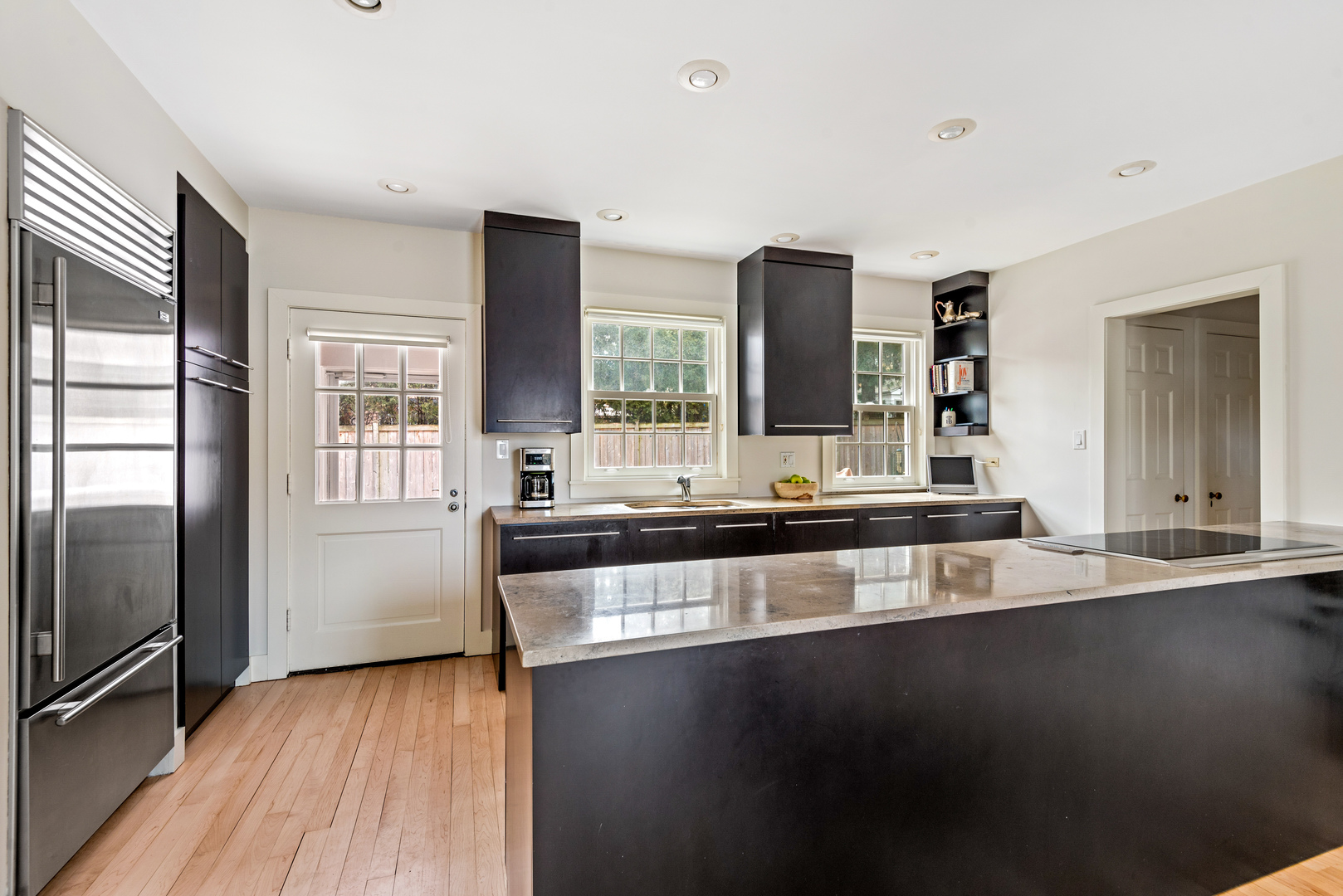700 Park Drive Kenilworth, IL 60043 - Photo 7 of 34 a large living room with stainless steel appliances wooden floor and a large window