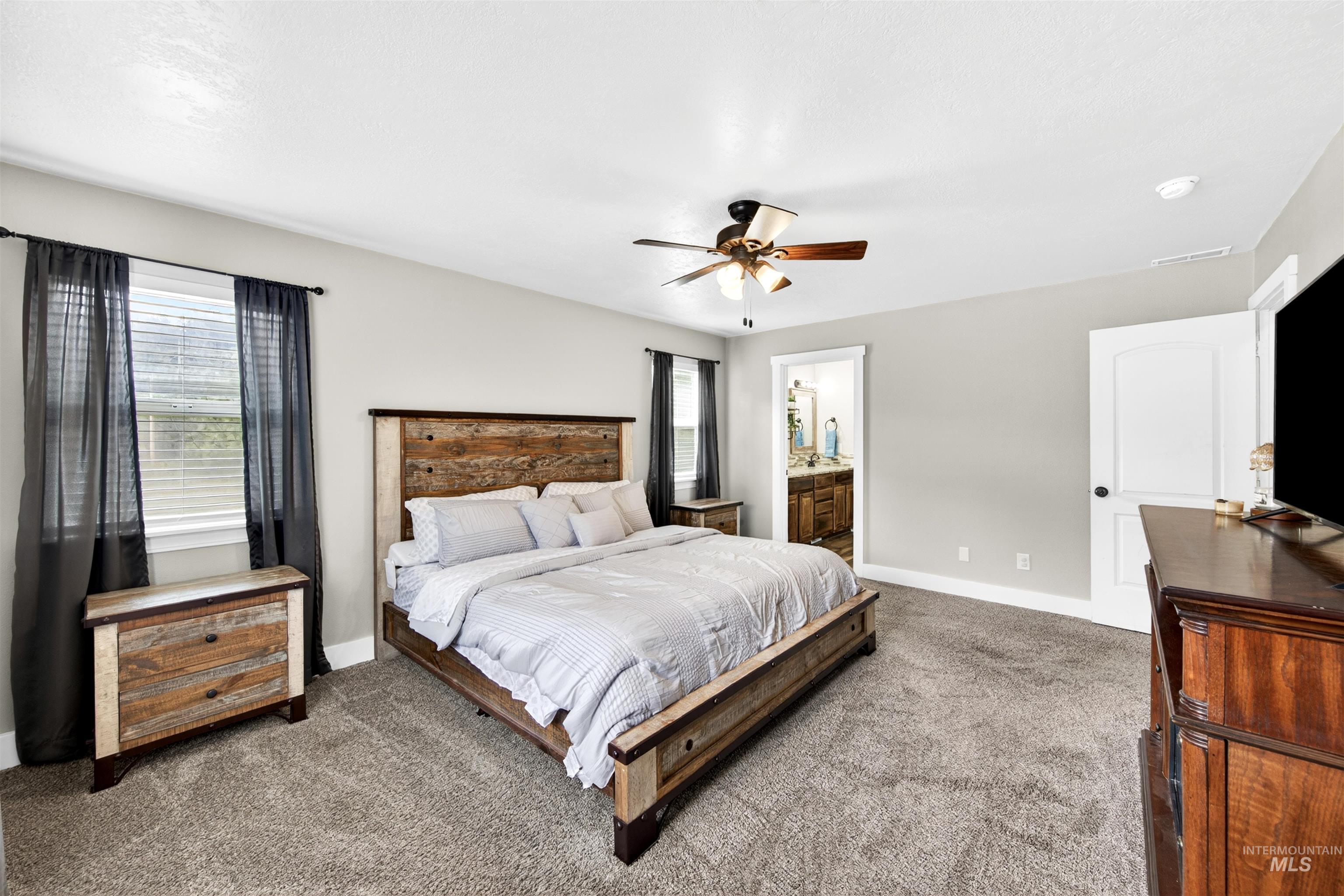 4 Round Up Circle Boise, ID 83716 - Photo 21 of 47 Carpeted bedroom with a ceiling fan, recessed lighting, and light gray wall paint