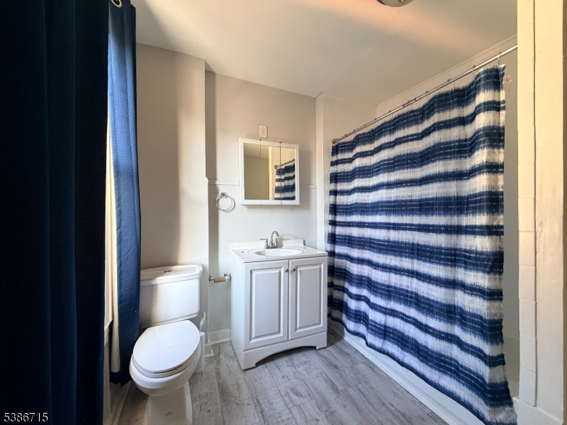 324 Summer Avenue, Unit 3 Newark, NJ 07104 - Photo 12 of 12 a bathroom with a sink toilet and shower