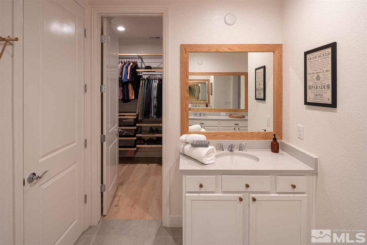 9523 Tencendur Lane Reno, NV 89521 - Photo 18 of 40 a bathroom with a sink a toilet and a mirror