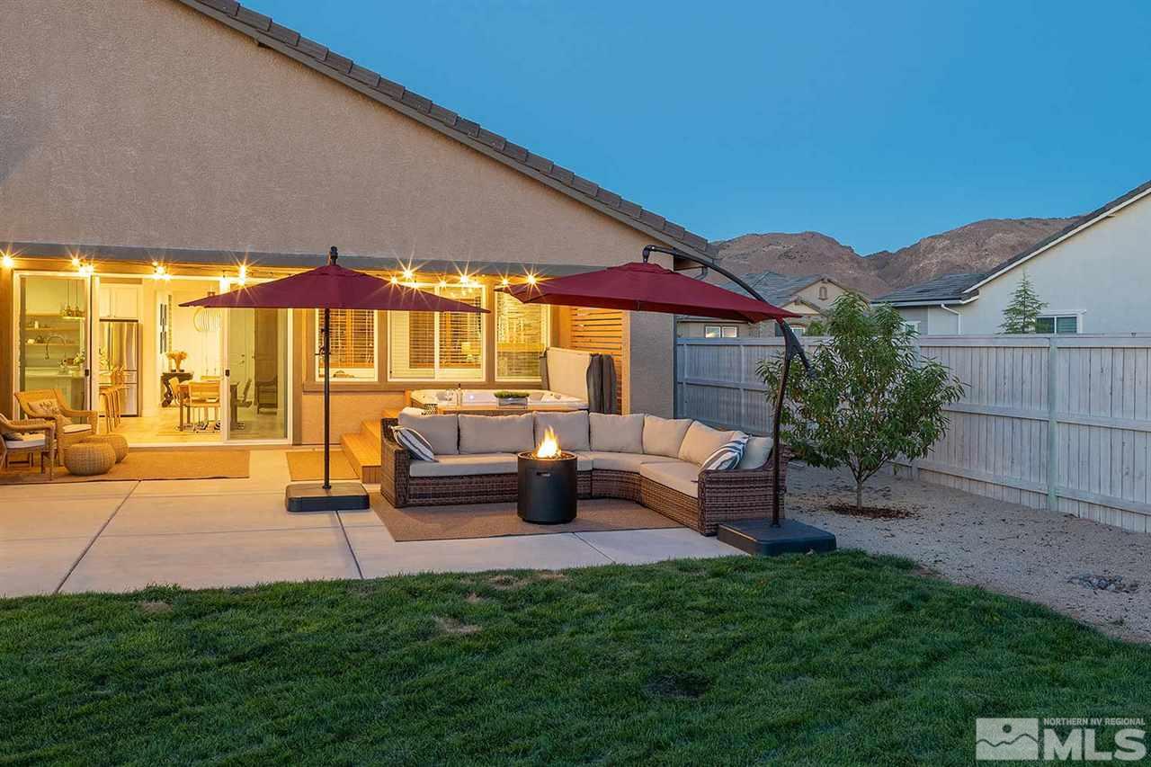 9523 Tencendur Lane Reno, NV 89521 - Photo 19 of 40 a backyard of a house with table and chairs
