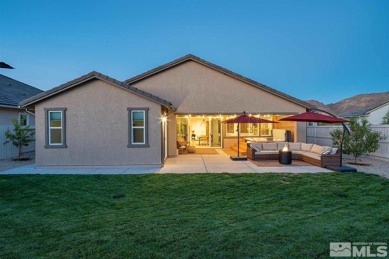 9523 Tencendur Lane Reno, NV 89521 - Photo 21 of 40 a front view of a house with patio and garden