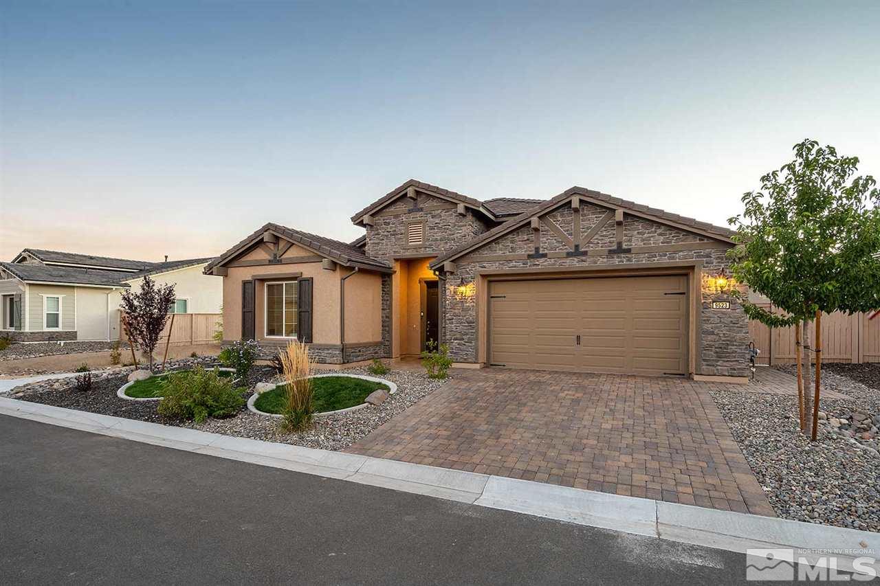 9523 Tencendur Lane Reno, NV 89521 - Photo 23 of 40 a view of a house with a yard and potted plants