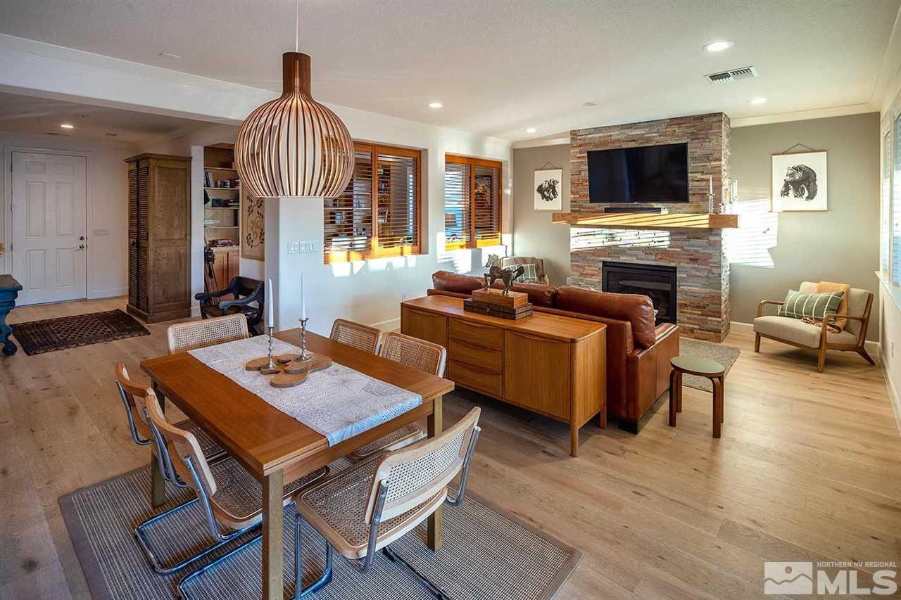 9523 Tencendur Lane Reno, NV 89521 - Photo 24 of 40 a living room with furniture a fireplace and a flat screen tv