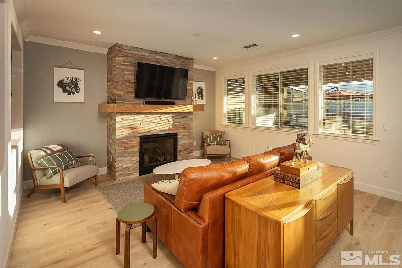9523 Tencendur Lane Reno, NV 89521 - Photo 26 of 40 a living room with furniture fireplace and flat screen tv