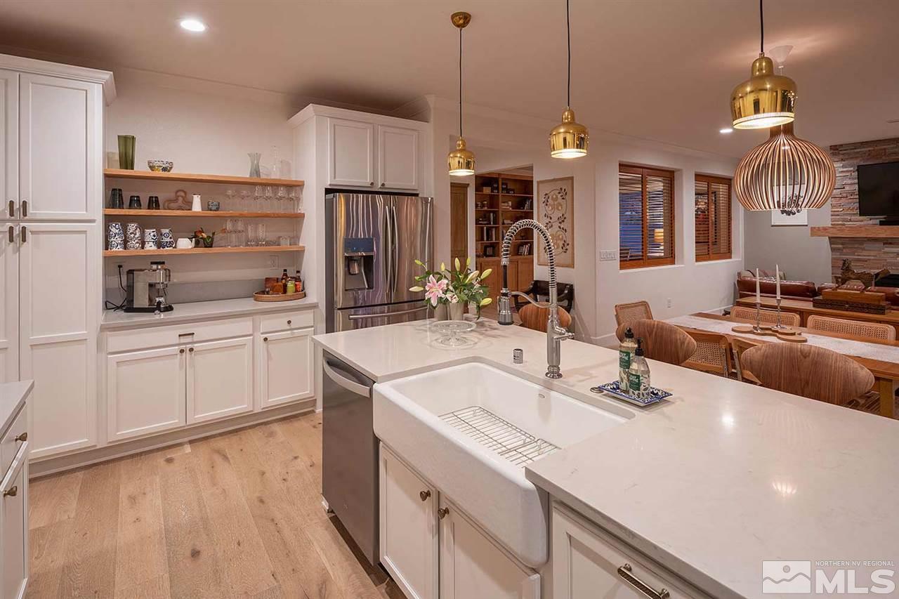 9523 Tencendur Lane Reno, NV 89521 - Photo 3 of 40 a kitchen with counter top space and stainless steel appliances