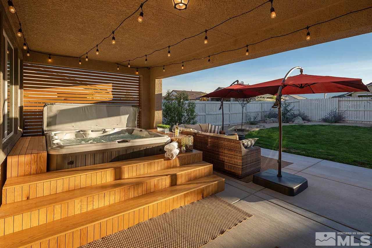9523 Tencendur Lane Reno, NV 89521 - Photo 38 of 40 a view of a patio with a table and chairs under an umbrella