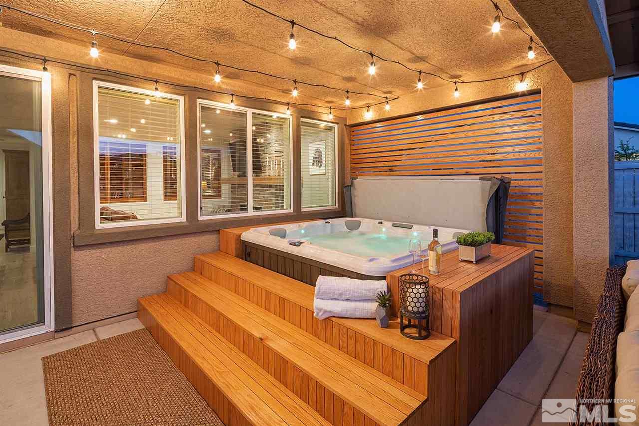 9523 Tencendur Lane Reno, NV 89521 - Photo 39 of 40 a bedroom with a bed and glass door