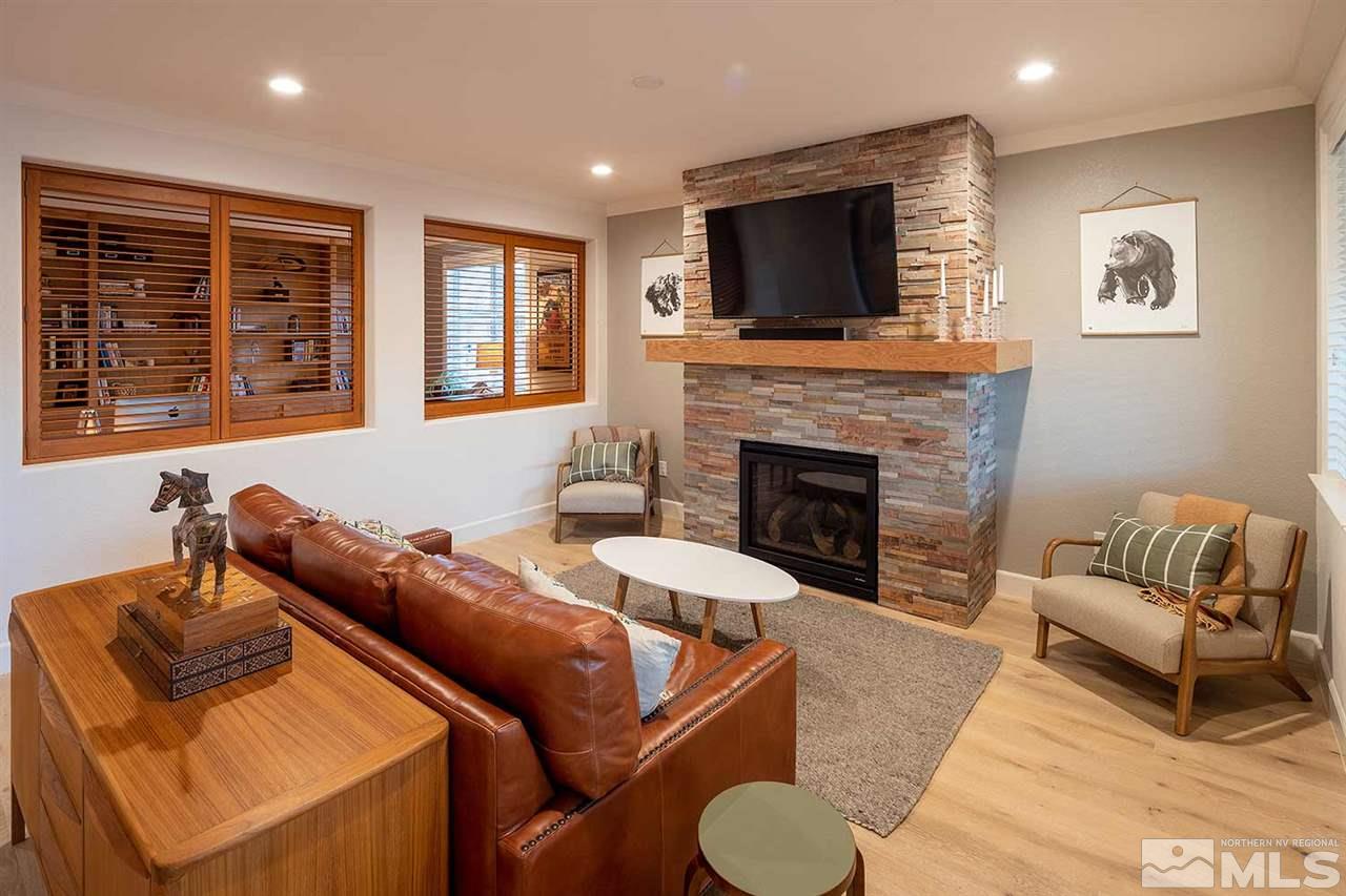 9523 Tencendur Lane Reno, NV 89521 - Photo 4 of 40 a living room with furniture and a fireplace
