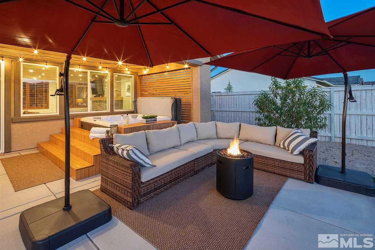 9523 Tencendur Lane Reno, NV 89521 - Photo 8 of 40 a view of a patio with couches and umbrella under an umbrella