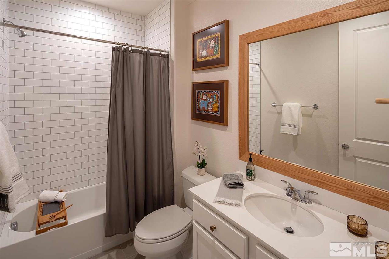 9523 Tencendur Lane Reno, NV 89521 - Photo 10 of 40 a bathroom with a sink toilet and shower