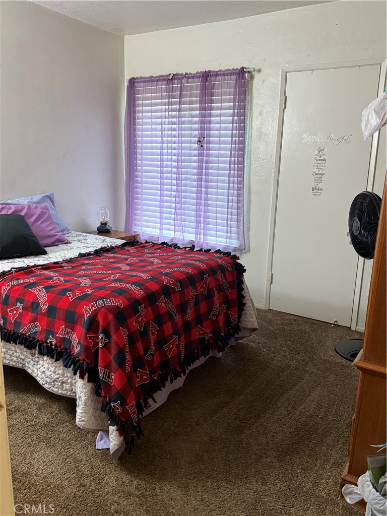 1340 West Lambert Road, Unit 85 La Habra, CA 90631 - Photo 11 of 17 a bed sitting in a bedroom next to a window