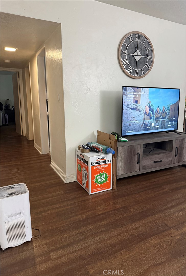 1340 West Lambert Road, Unit 85 La Habra, CA 90631 - Photo 5 of 17 a view of a hallway with wooden floor and a workspace