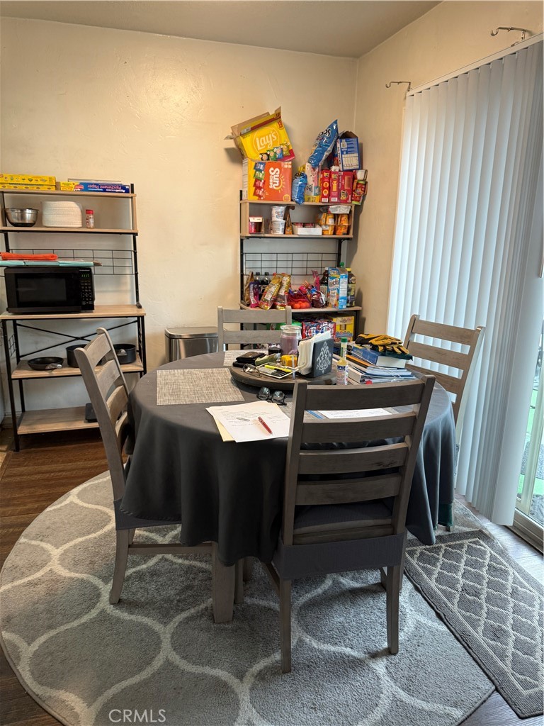1340 West Lambert Road, Unit 85 La Habra, CA 90631 - Photo 9 of 17 a room with a table chairs and a stove