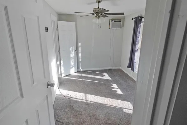 a view of a hallway with closet area
