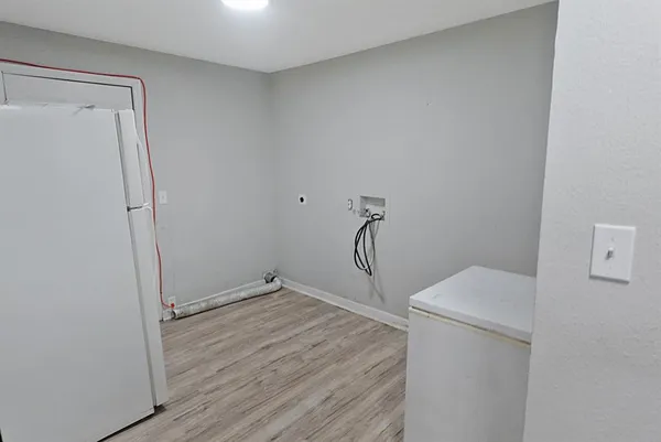 a view of a storage & utility room with a washer dryer