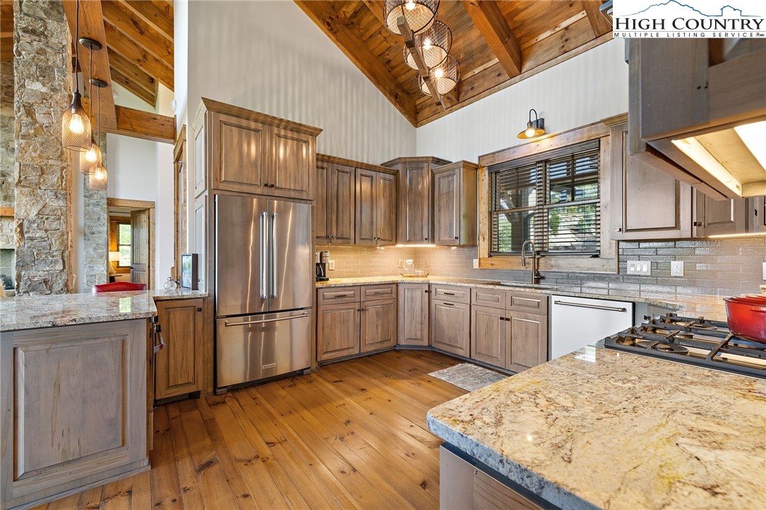 559 Marigold Road Boone, NC 28607 - Photo 13 of 46 a kitchen with a sink refrigerator and cabinets