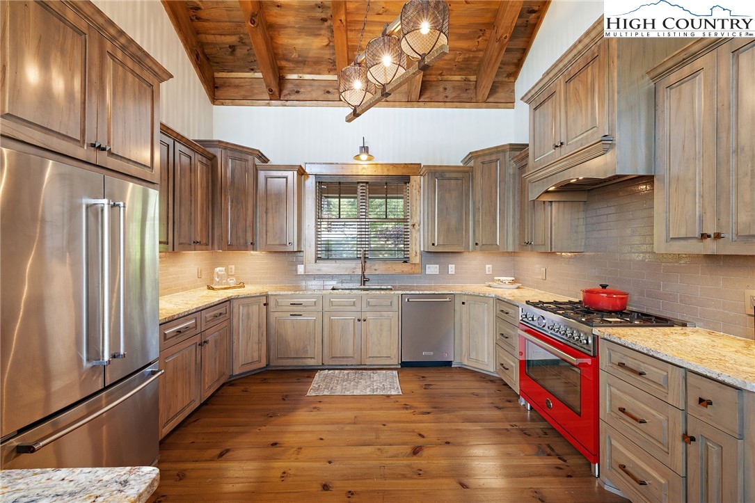 559 Marigold Road Boone, NC 28607 - Photo 14 of 46 a kitchen with cabinets and wooden floor