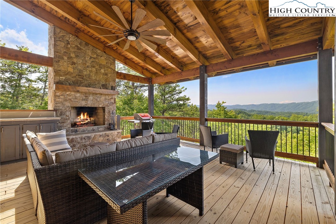 559 Marigold Road Boone, NC 28607 - Photo 23 of 46 a living room with patio furniture and a fireplace