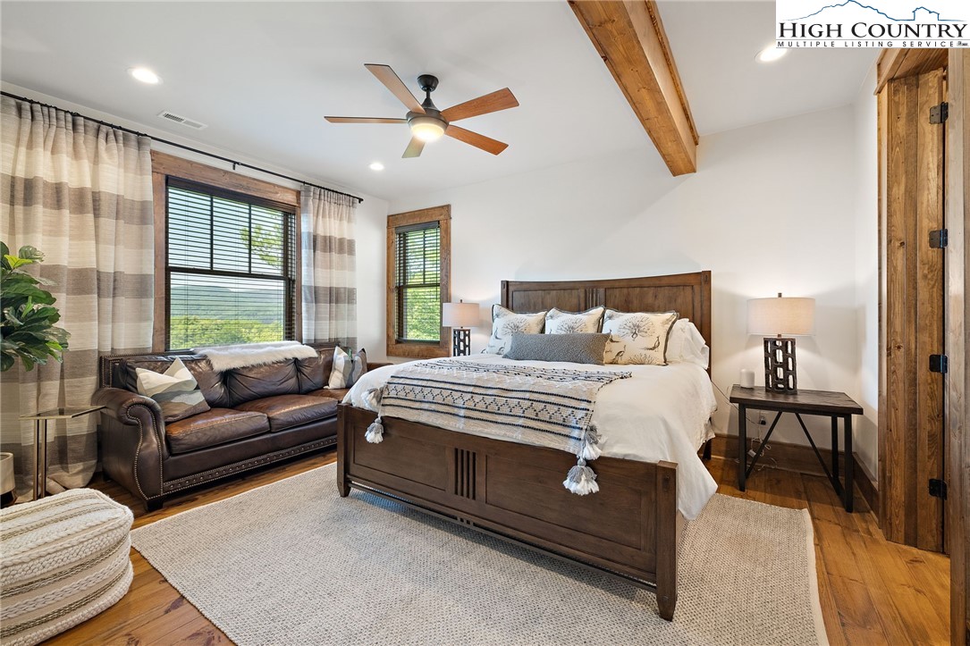 559 Marigold Road Boone, NC 28607 - Photo 28 of 46 a bedroom with a bed couch and window