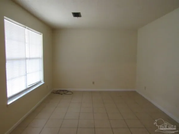 an empty room with a empty space and window