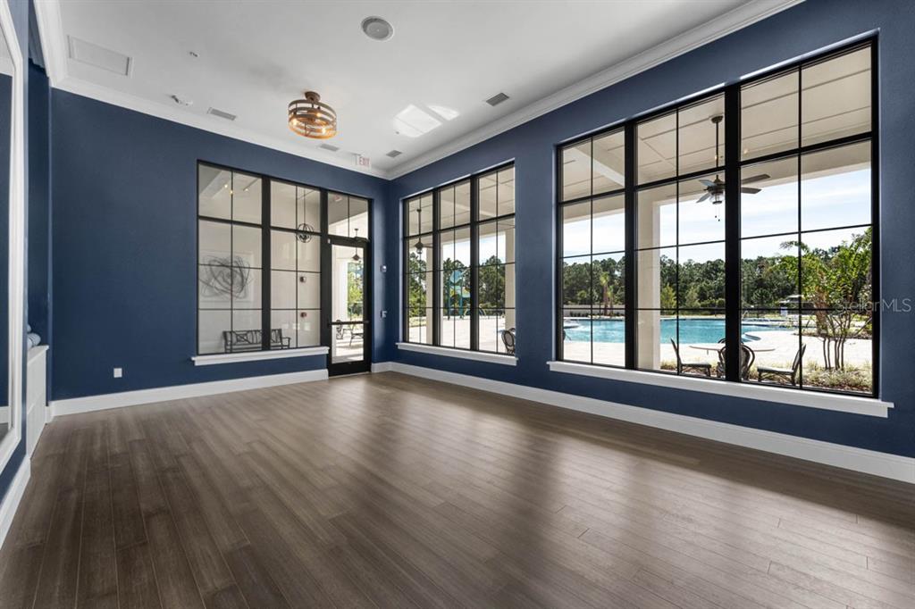 3002 House Finch Road St. Cloud, FL 34773 - Photo 7 of 38 a view of room with window and hardwood floor