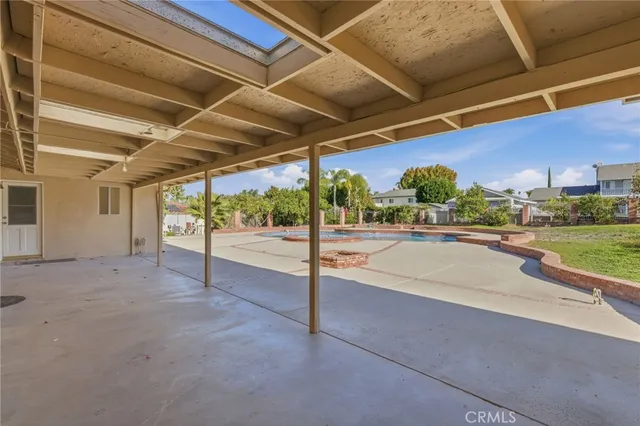 an aerial view of a house with garden space and street view