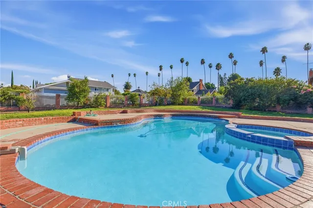 a view of a swimming pool with a lounge chairs