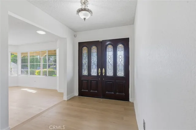 a view of an entryway with wooden floor