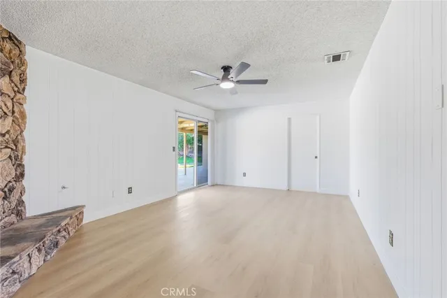 a kitchen with stainless steel appliances a sink stove and cabinets