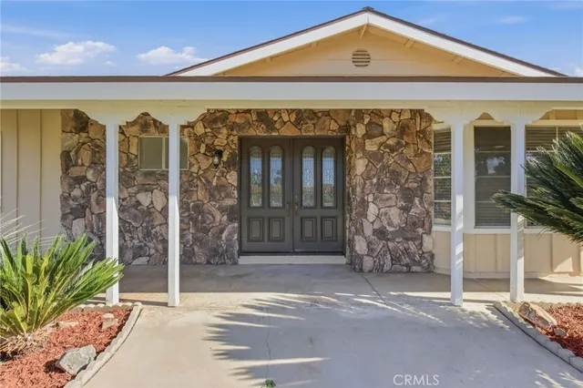 a front view of a building with a porch