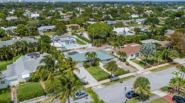 an aerial view of residential houses with outdoor space
