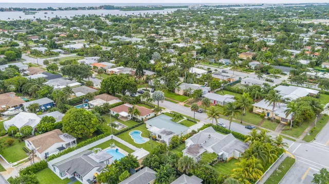 an aerial view of residential houses with outdoor space