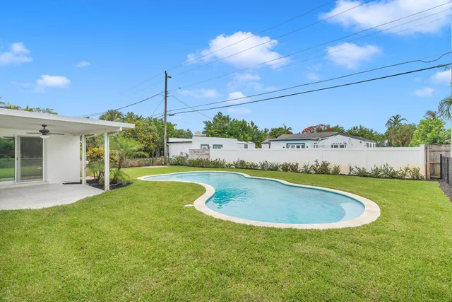 a view of swimming pool with seating space