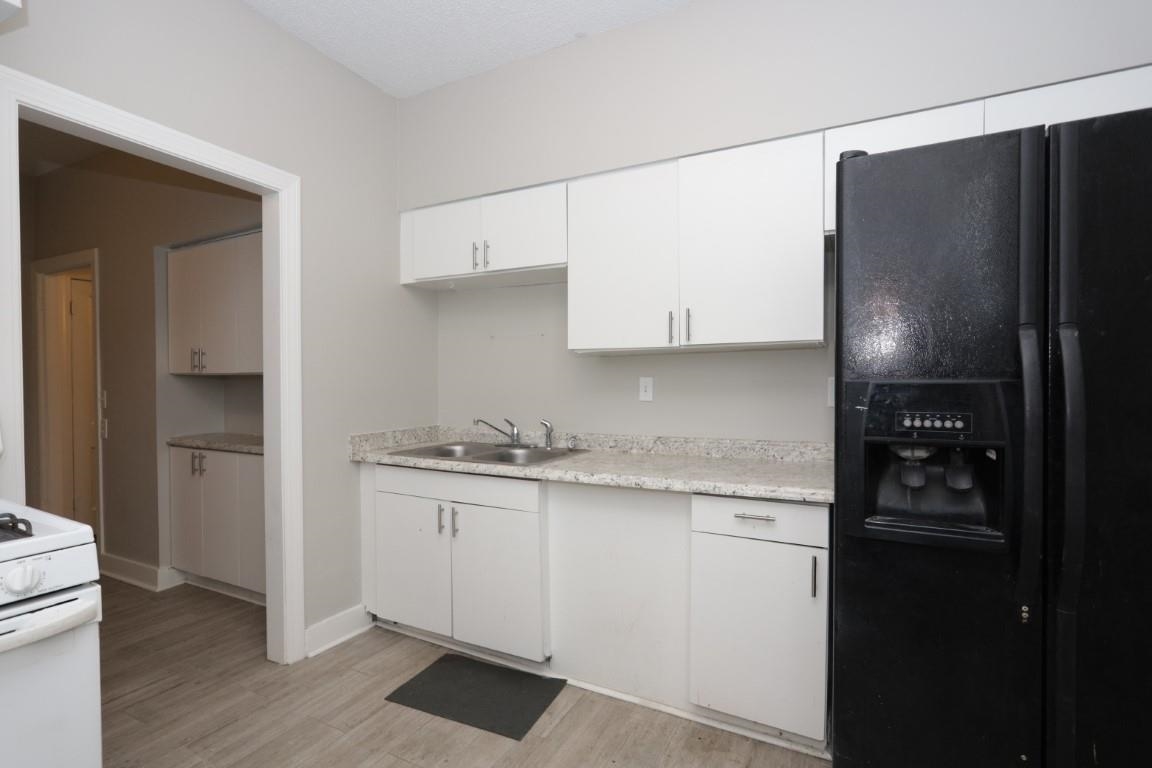 2367 Forrest Avenue, Unit 1 Memphis, TN 38112 - Photo 4 of 9 a kitchen with stainless steel appliances granite countertop a refrigerator and a stove