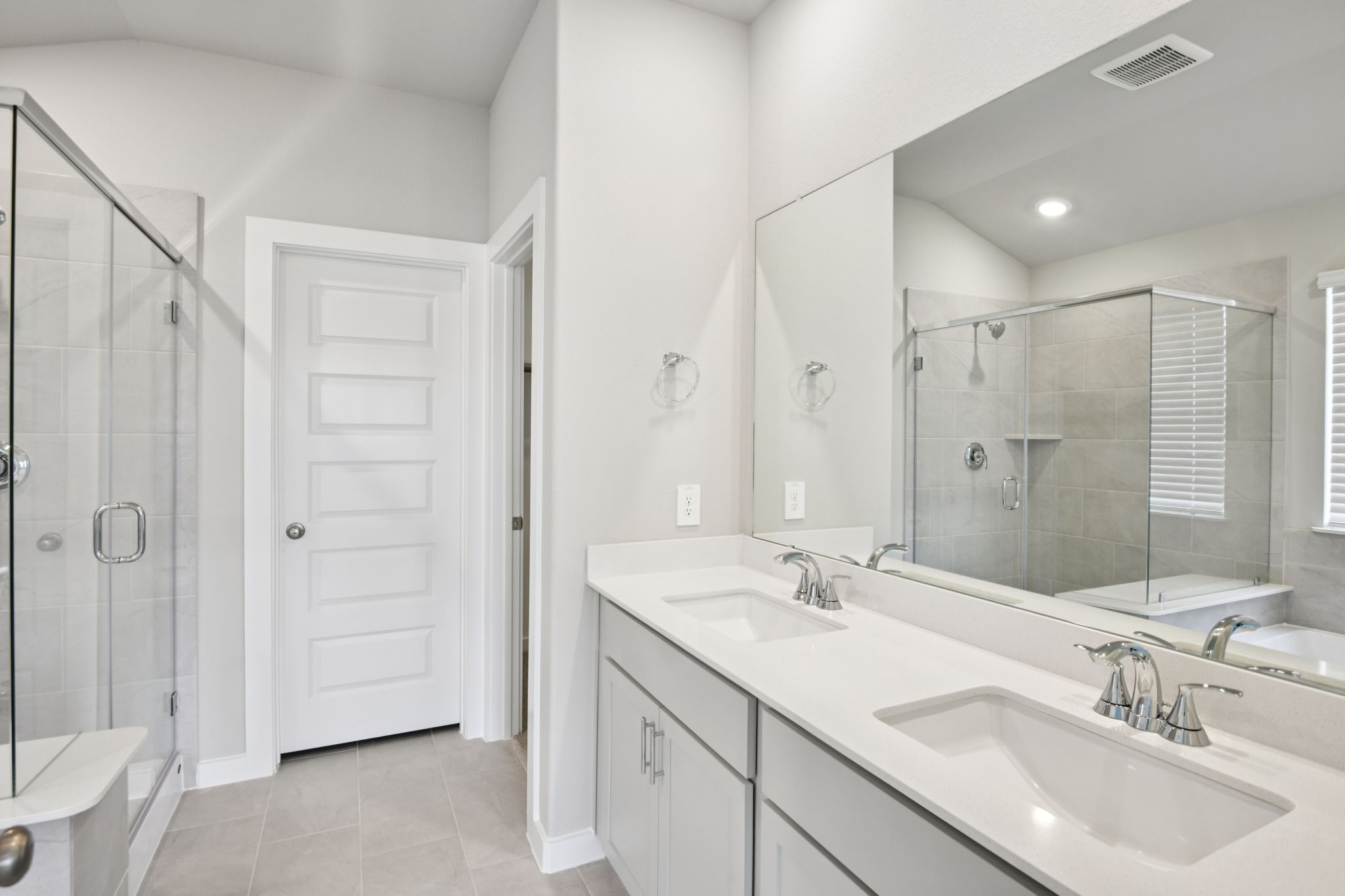 1672 Hopson Ranch Drive Conroe, TX 77301 - Photo 26 of 44 a bathroom with a double vanity sink mirror and