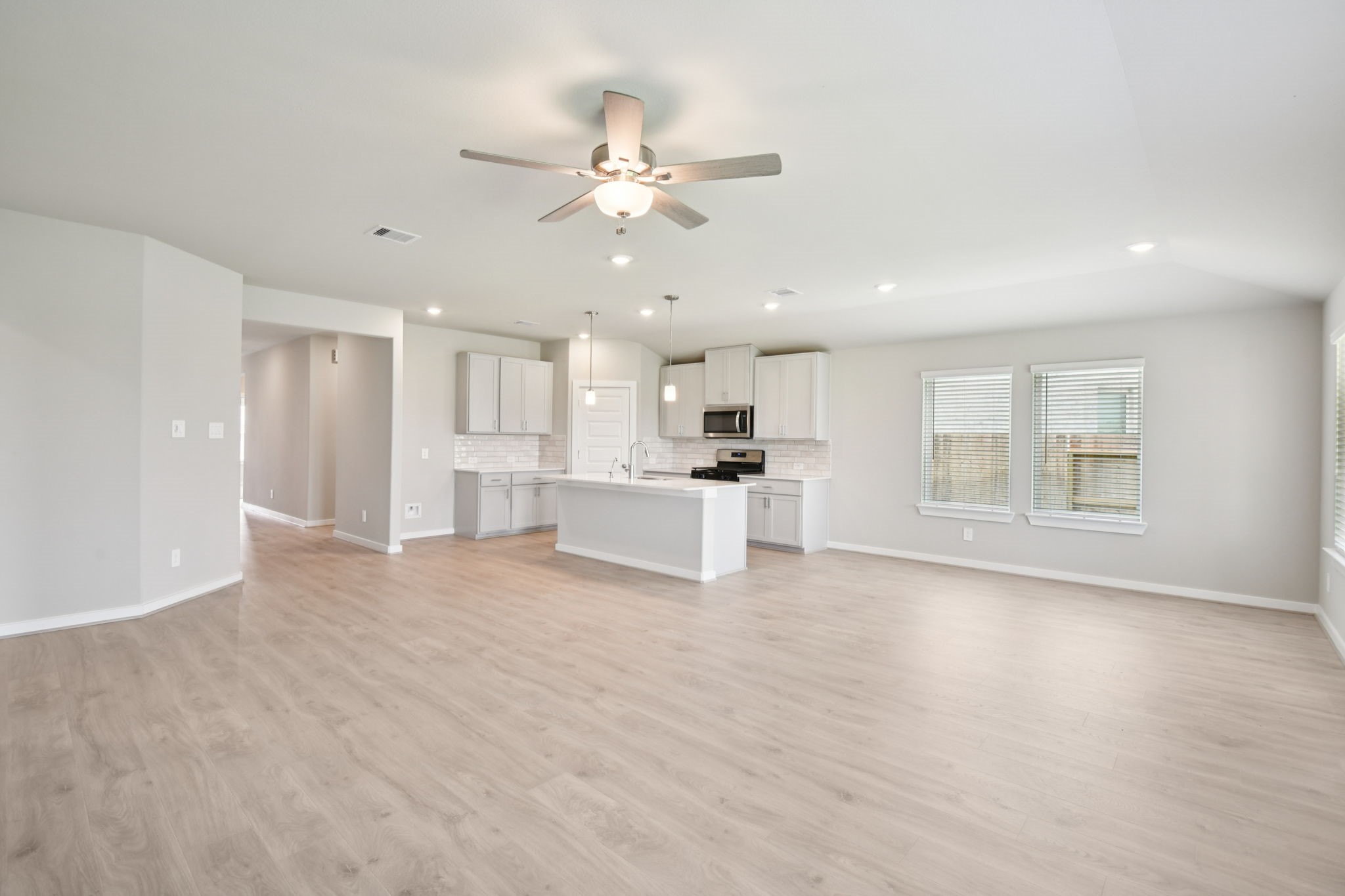 1672 Hopson Ranch Drive Conroe, TX 77301 - Photo 7 of 44 a view of a kitchen with a sink and a window