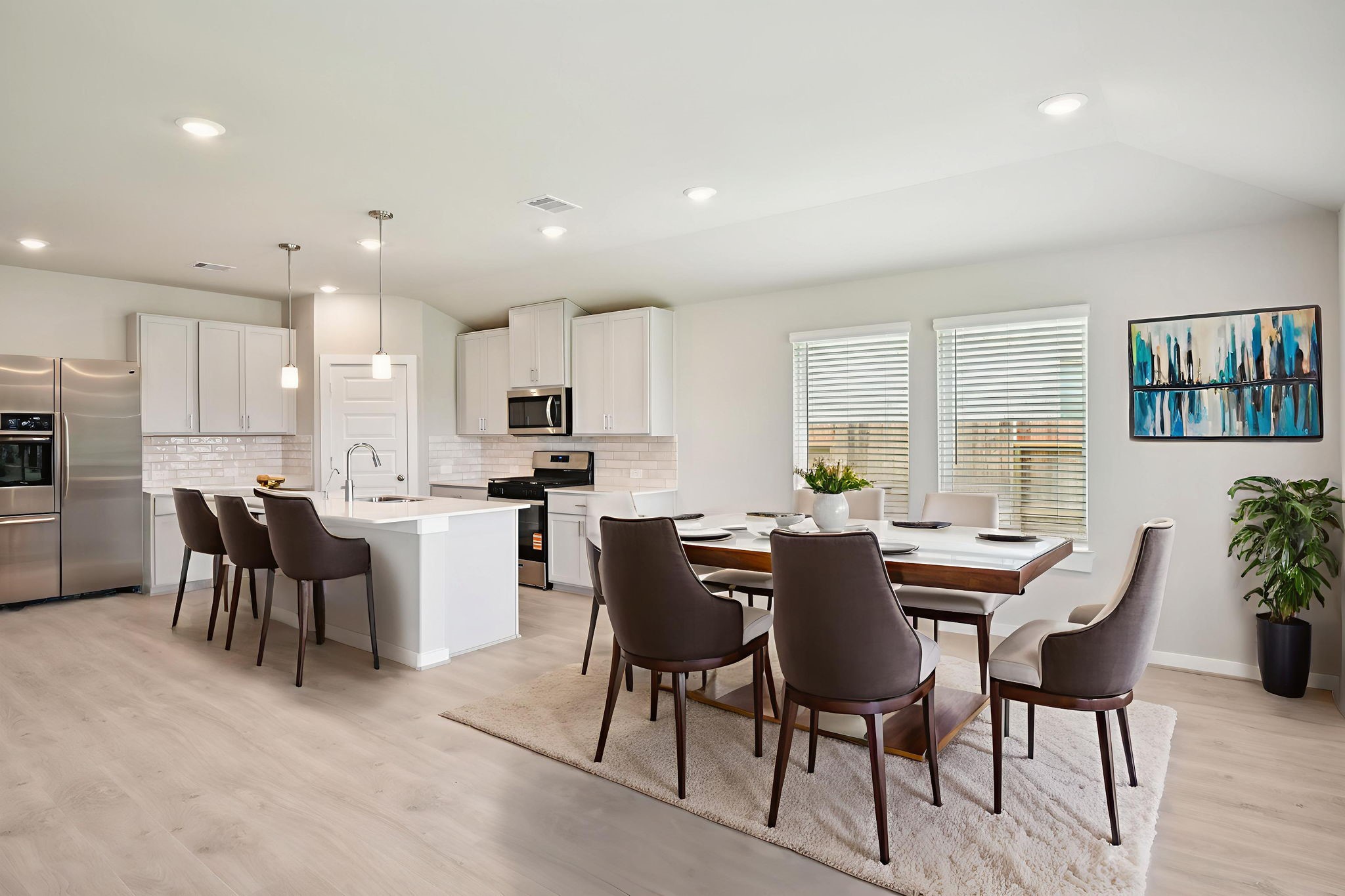 1672 Hopson Ranch Drive Conroe, TX 77301 - Photo 8 of 44 a view of a dining room with furniture and a kitchen