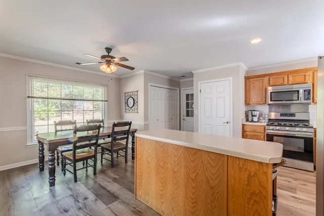 a view of a dining room with furniture window and outside view