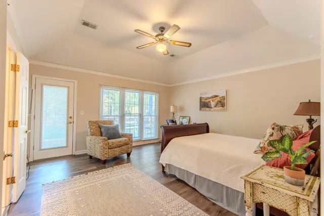 a bedroom with a bed couch and window