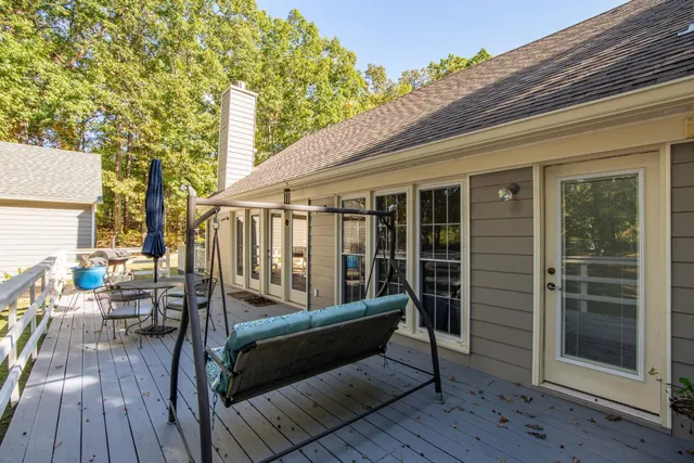 a view of a two chairs in the balcony