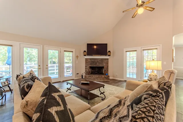 a living room with furniture fireplace and flat screen tv