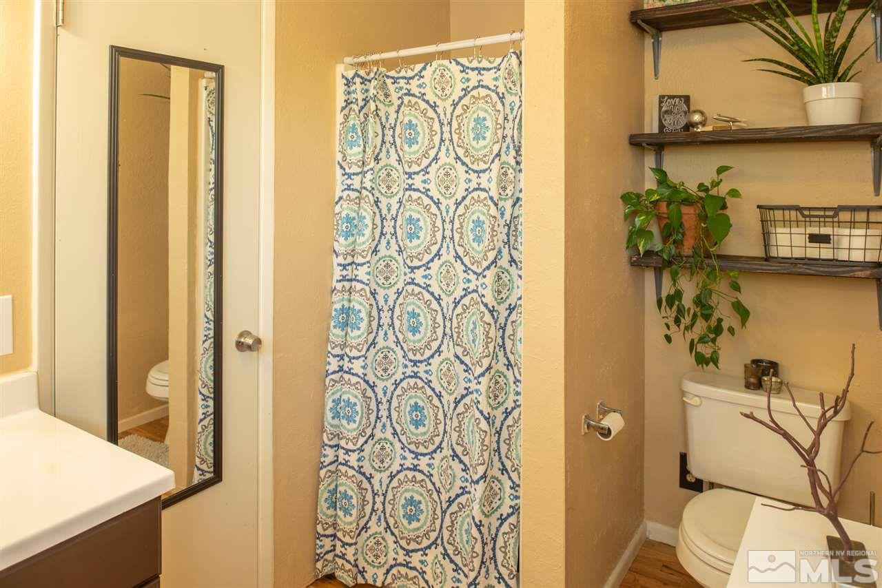 880 Beldon Way Reno, NV 89503 - Photo 11 of 20 a bathroom with a shower curtain and a sink