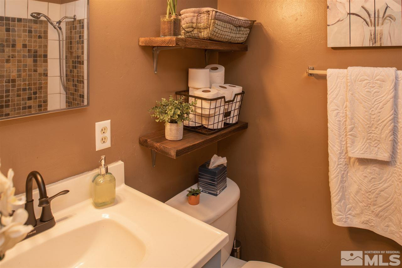 880 Beldon Way Reno, NV 89503 - Photo 14 of 20 a bathroom with a sink and a mirror