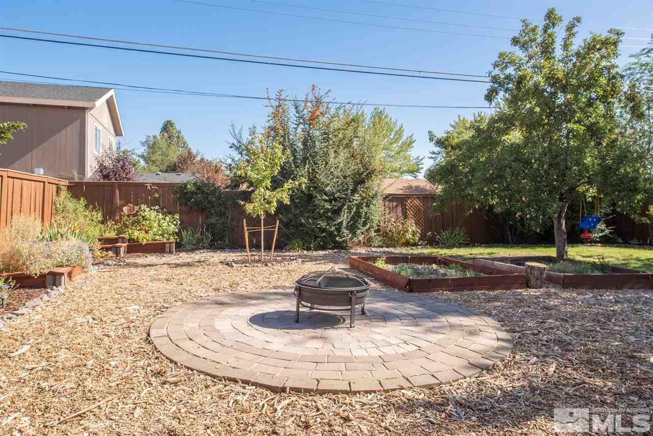 880 Beldon Way Reno, NV 89503 - Photo 17 of 20 a view of a house with a yard and garage