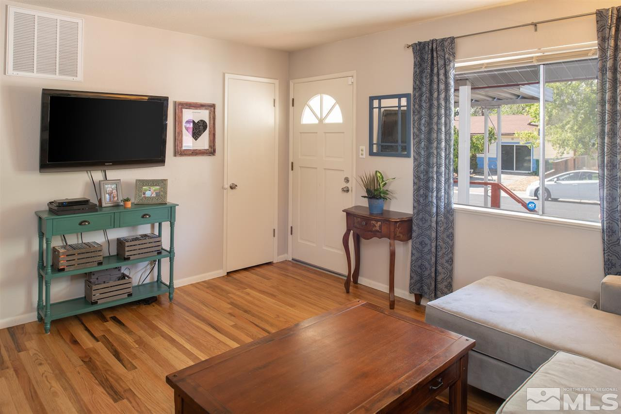 880 Beldon Way Reno, NV 89503 - Photo 5 of 20 a living room with furniture and a flat screen tv