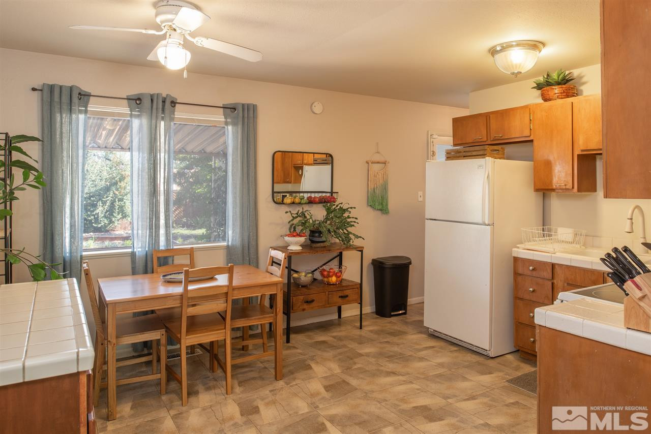 880 Beldon Way Reno, NV 89503 - Photo 6 of 20 a view of a dining room with furniture window and outside view