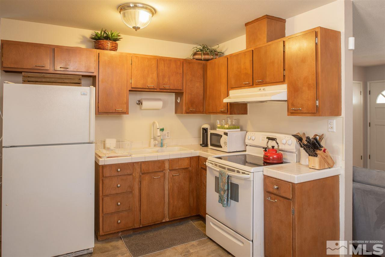 880 Beldon Way Reno, NV 89503 - Photo 7 of 20 a utility room with cabinets washer and dryer